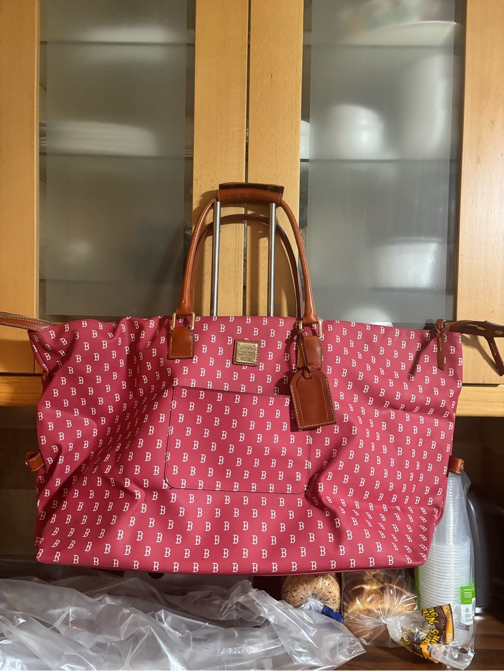 Dooney & Bourke Red Logo weekend bag with Tan Leather Trim